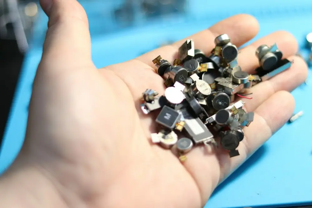Handful of electronics components ready for recycling, illustrating selecting appropriate replacement components